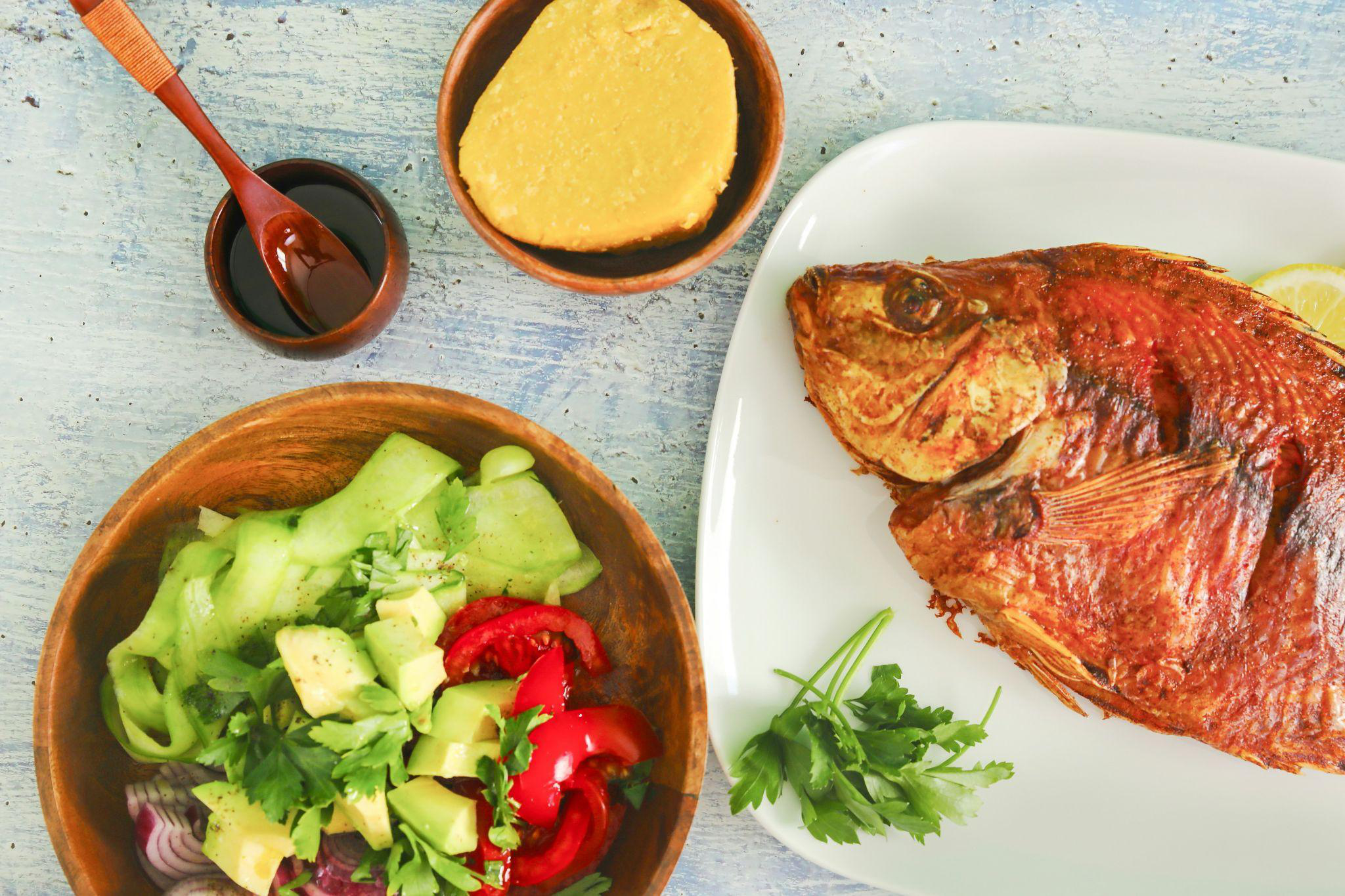 Kachumbari salad served with fish and ugali