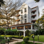 A luxury safari lodge in Kenya surrounded by lush greenery, offering travelers a tranquil base for wildlife adventures.