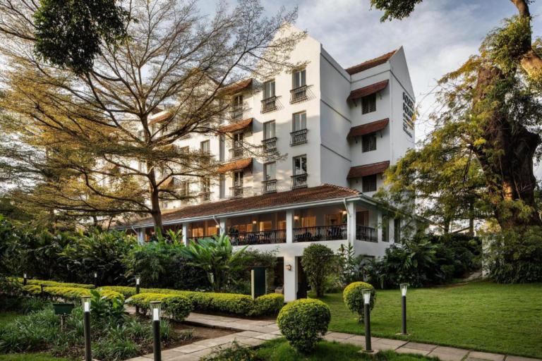 A luxury safari lodge in Kenya surrounded by lush greenery, offering travelers a tranquil base for wildlife adventures.